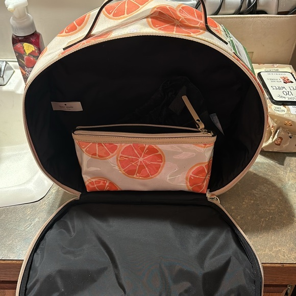 Kate Spade 11” clutch NWT. The only flaw is a small water mark under plastic. - Picture 3 of 16